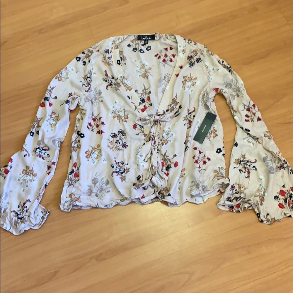 Flowy top with draw string front. Bell sleeves
